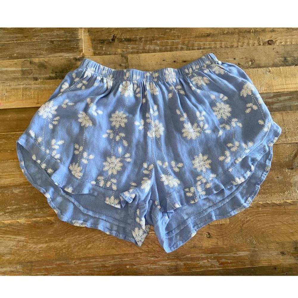blue floral shorts with frill detail on bottom